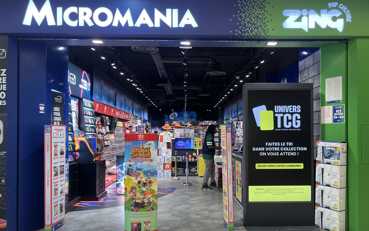 Entrance of a Micromania Zing store with its trading card area